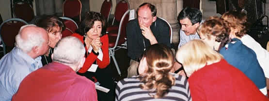 10 people isitting in a tight circle.